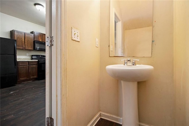 bathroom with wood-type flooring