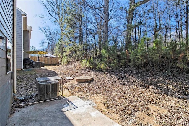 view of yard with a patio area and central air condition unit