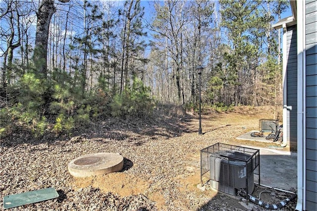 view of yard featuring central AC unit