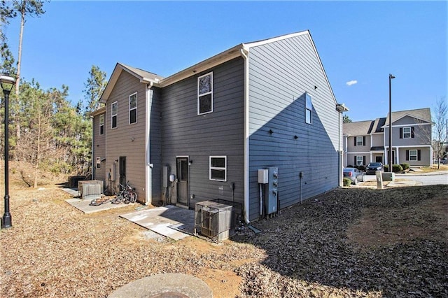 back of house with cooling unit