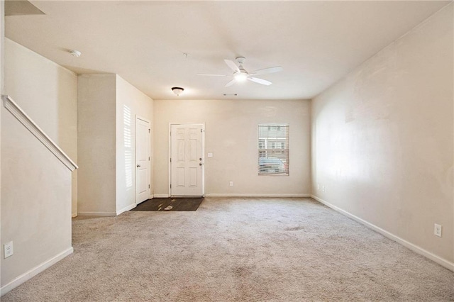 interior space with ceiling fan