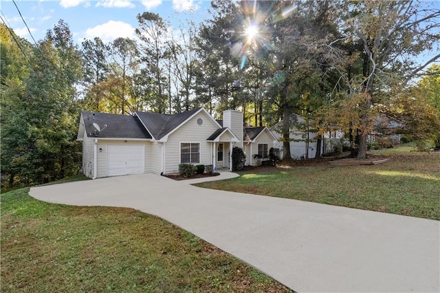 view of front of home with a garage and a front yard