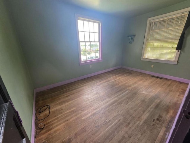 1437 Troupe St, Augusta, GA 30904 - empty room with wood finished floors and baseboards