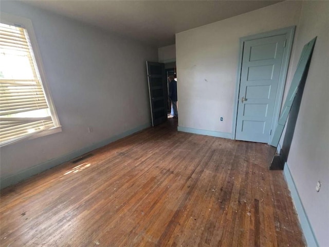1437 Troupe St, Augusta, GA 30904 - unfurnished bedroom featuring hardwood / wood-style flooring and baseboards