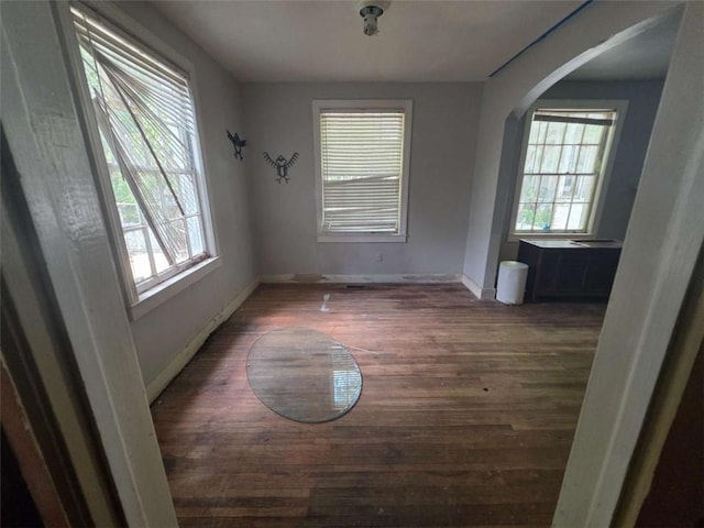 1437 Troupe St, Augusta, GA 30904 - unfurnished dining area featuring wood finished floors and arched walkways