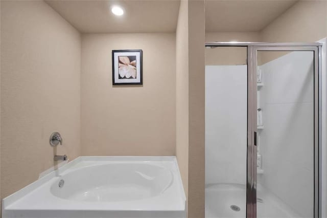 157 Oliver Dr, Locust Grove, GA 30248 - bathroom featuring a shower stall and a garden tub