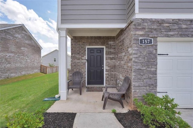 157 Oliver Dr, Locust Grove, GA 30248 - entrance to property with brick siding, a garage, and a yard