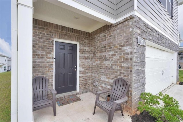 157 Oliver Dr, Locust Grove, GA 30248 - entrance to property with concrete driveway, brick siding, and an attached garage