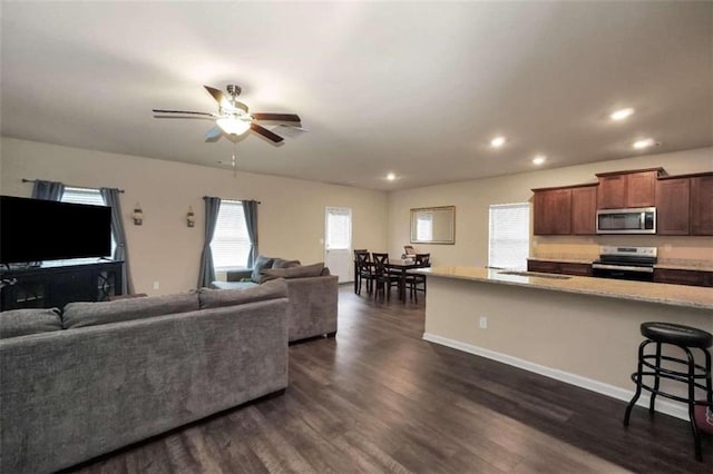 157 Oliver Dr, Locust Grove, GA 30248 - living area with recessed lighting, ceiling fan, dark wood finished floors, and baseboards