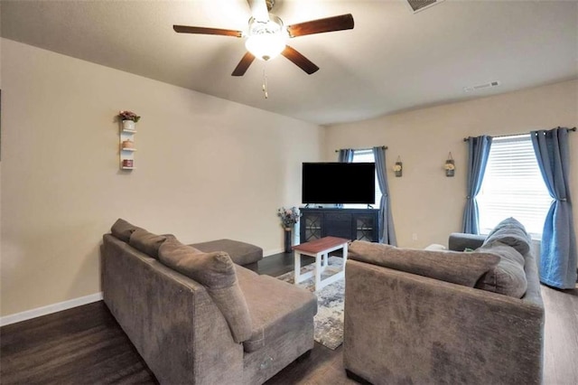 157 Oliver Dr, Locust Grove, GA 30248 - living area with baseboards, a ceiling fan, dark wood finished floors, and visible vents