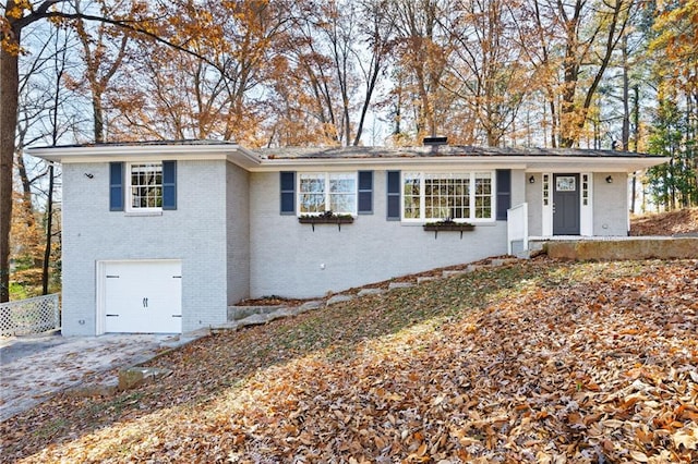 single story home featuring a garage