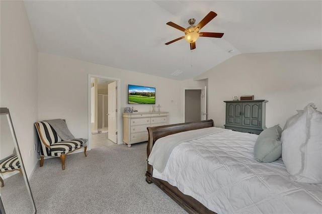 bedroom with lofted ceiling, ensuite bathroom, a ceiling fan, and light colored carpet