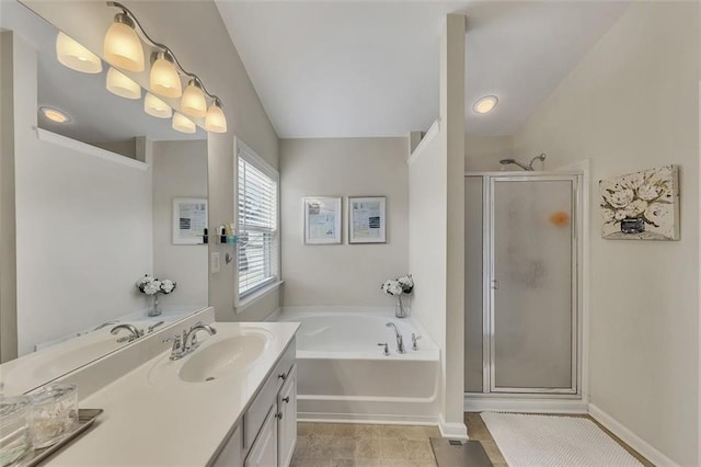 bathroom featuring a garden tub, lofted ceiling, a stall shower, vanity, and tile patterned floors