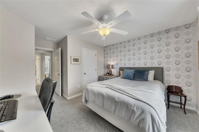 bedroom with baseboards, a ceiling fan, light colored carpet, and wallpapered walls