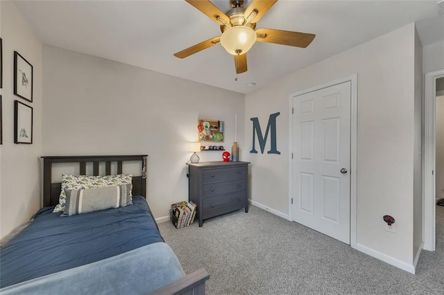 bedroom featuring baseboards, a ceiling fan, and light colored carpet