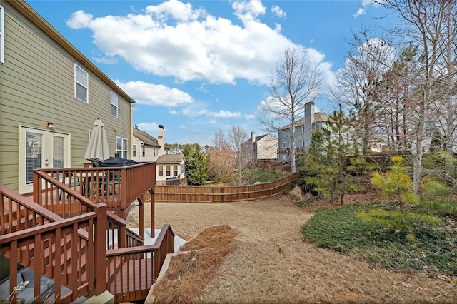 view of yard with a deck and fence