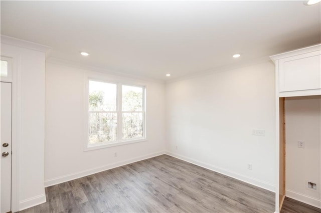 706 Dodd Ln Unit 157, Buford, GA 30518 - unfurnished bedroom with ornamental molding, wood finished floors, recessed lighting, and baseboards