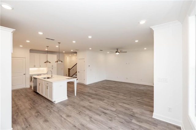 706 Dodd Ln Unit 157, Buford, GA 30518 - kitchen with a sink, ceiling fan, light wood-style flooring, recessed lighting, and light countertops