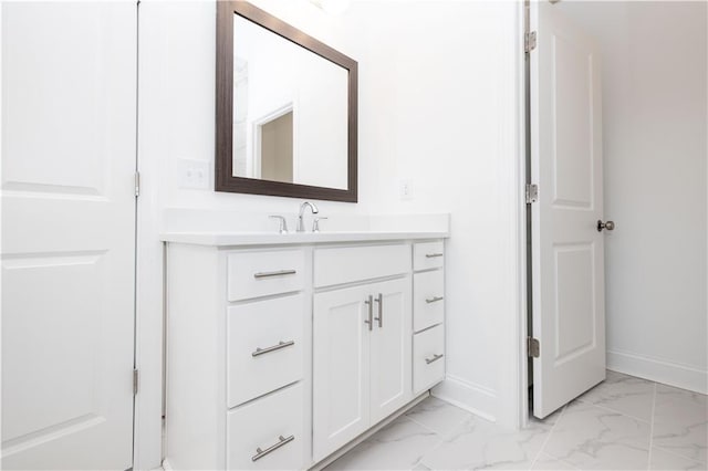 706 Dodd Ln Unit 157, Buford, GA 30518 - bathroom with baseboards, vanity, and marble finish floors