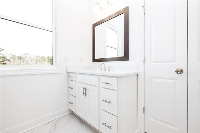 706 Dodd Ln Unit 157, Buford, GA 30518 - bathroom featuring marble look tile flooring, vanity, and baseboards