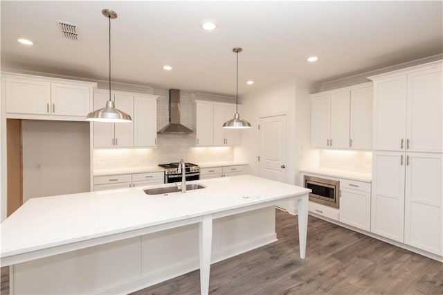 706 Dodd Ln Unit 157, Buford, GA 30518 - kitchen with wall chimney range hood, a sink, stainless steel appliances, decorative backsplash, and white cabinets