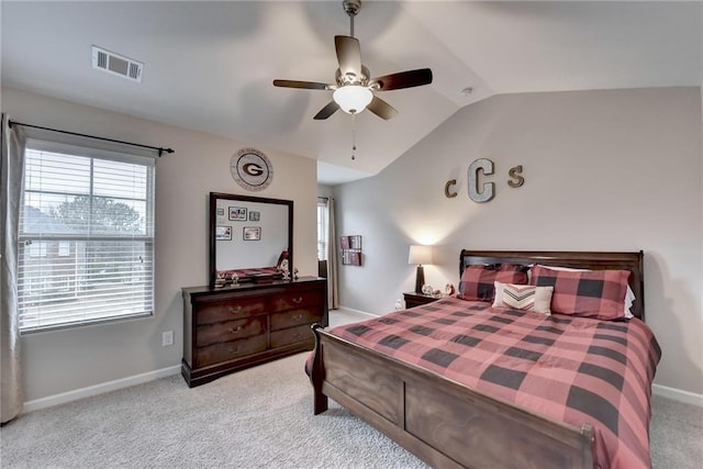 carpeted bedroom with vaulted ceiling and ceiling fan