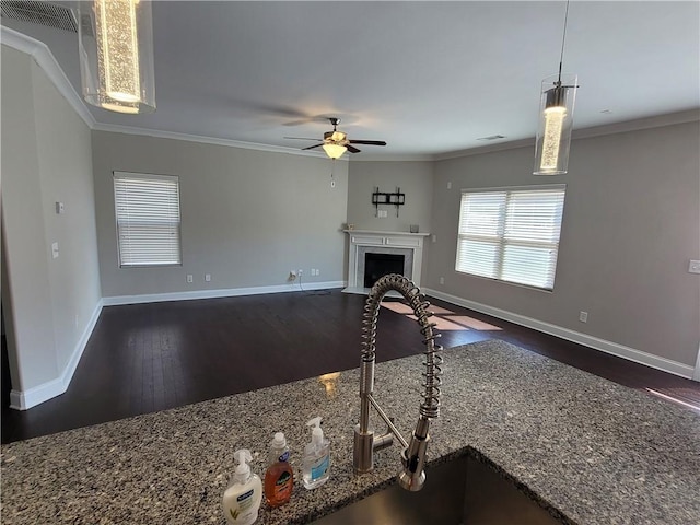 living room featuring ornamental molding, sink, ceiling fan, and dark hardwood / wood-style flooring