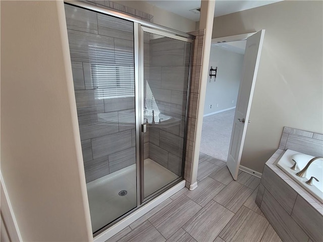 bathroom with independent shower and bath