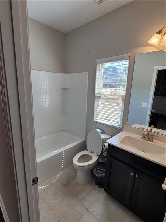 full bathroom with shower / bath combination, vanity, toilet, and tile patterned flooring