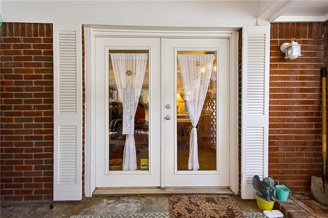 view of exterior entry featuring french doors