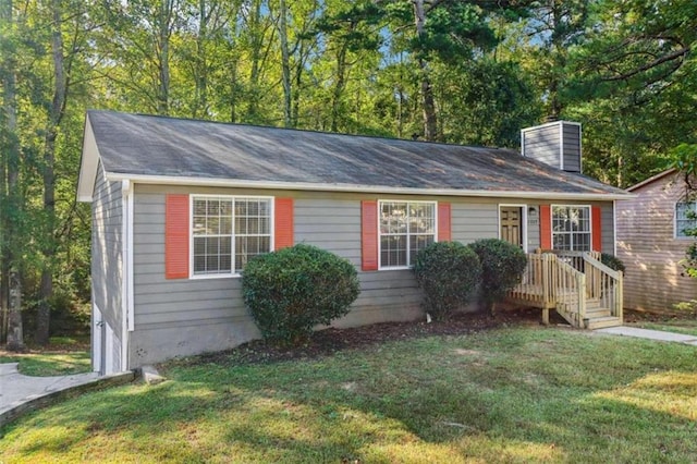 single story home with a front yard