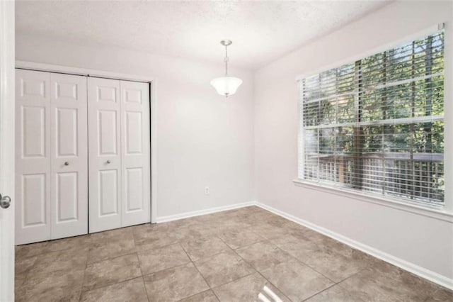 interior space featuring a textured ceiling