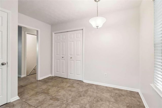 interior space featuring a closet and light tile patterned floors