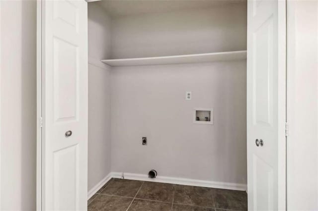 washroom featuring washer hookup, electric dryer hookup, and dark tile patterned flooring