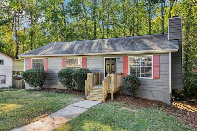 ranch-style house with a front yard