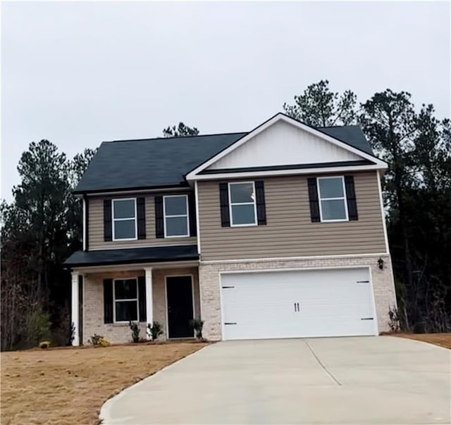 30 Barton Ln, Covington, GA 30016 - view of front of home with driveway, an attached garage, and brick siding