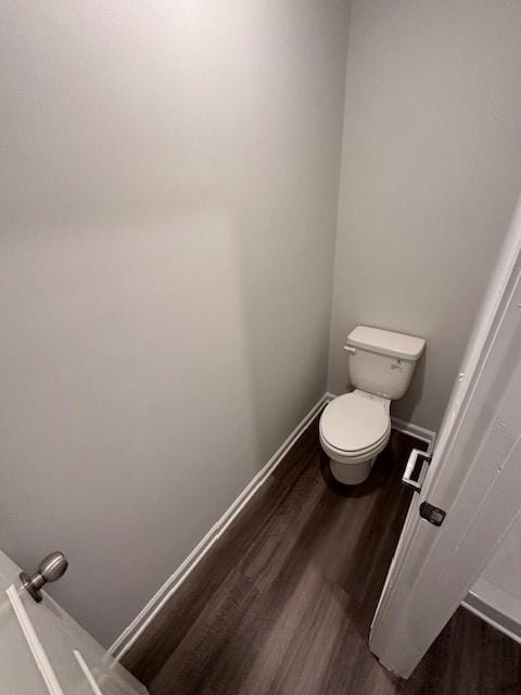 30 Barton Ln, Covington, GA 30016 - bathroom with wood finished floors, toilet, and baseboards