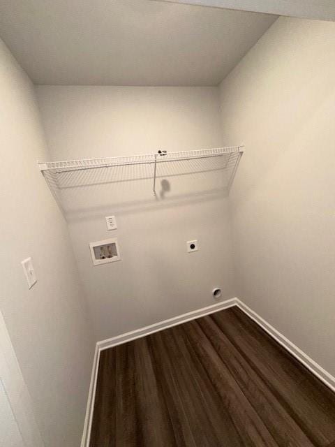 30 Barton Ln, Covington, GA 30016 - laundry area featuring electric dryer hookup, hookup for a washing machine, dark wood-style flooring, and baseboards