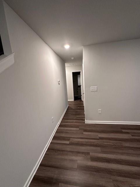 30 Barton Ln, Covington, GA 30016 - hallway with dark wood-style floors, baseboards, and recessed lighting