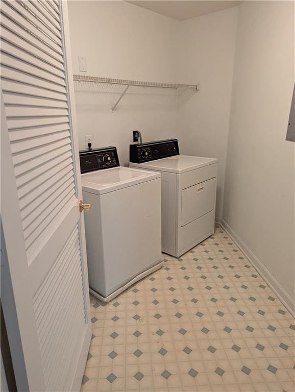 clothes washing area with washer and dryer