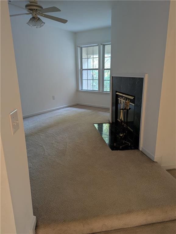 living room featuring light carpet and ceiling fan