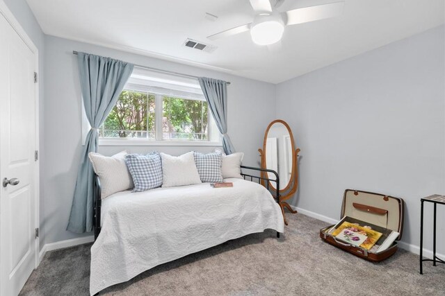 bedroom featuring carpet floors, a ceiling fan, baseboards, and visible vents