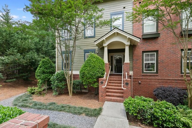 view of front of home featuring brick siding