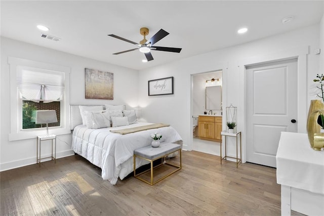 1643 Flintwood Dr SE, Atlanta, GA 30316 - bedroom featuring light wood finished floors, a sink, baseboards, recessed lighting, and ensuite bathroom