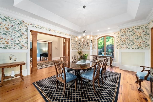 1447 Travis Smith Rd, Clarkesville, GA 30523 - dining space with wallpapered walls, a wainscoted wall, a chandelier, a raised ceiling, and light wood-style floors