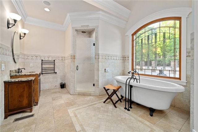 1447 Travis Smith Rd, Clarkesville, GA 30523 - full bathroom with tile walls, a stall shower, vanity, a soaking tub, and wainscoting