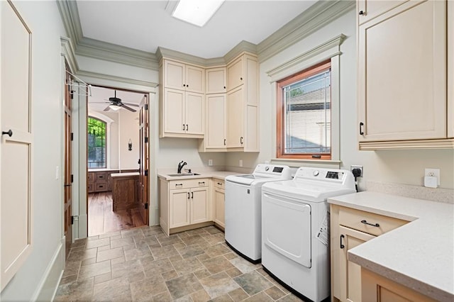 1447 Travis Smith Rd, Clarkesville, GA 30523 - laundry room with washing machine and dryer, cabinet space, light stone finish flooring, ceiling fan, and ornamental molding