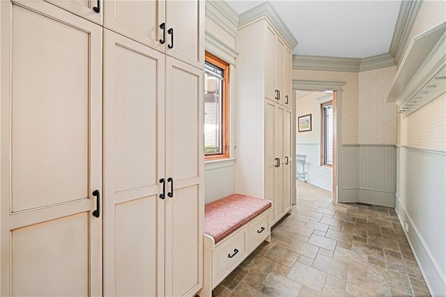 1447 Travis Smith Rd, Clarkesville, GA 30523 - mudroom with light stone finish floors, healthy amount of natural light, wainscoting, ornamental molding, and baseboards