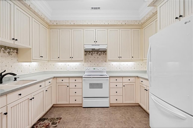 1447 Travis Smith Rd, Clarkesville, GA 30523 - kitchen featuring white appliances, under cabinet range hood, cream cabinetry, and crown molding