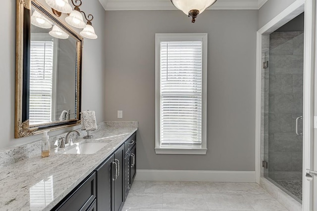 bathroom with marble finish floor, ornamental molding, and vanity